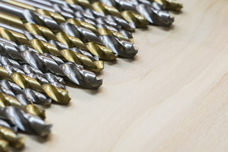 A lot of drill is on a wooden surface. Work on metal.の写真素材