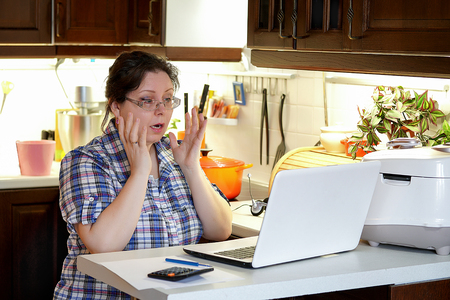 Office in the home kitchen, businesswoman. Work at home.                          の写真素材