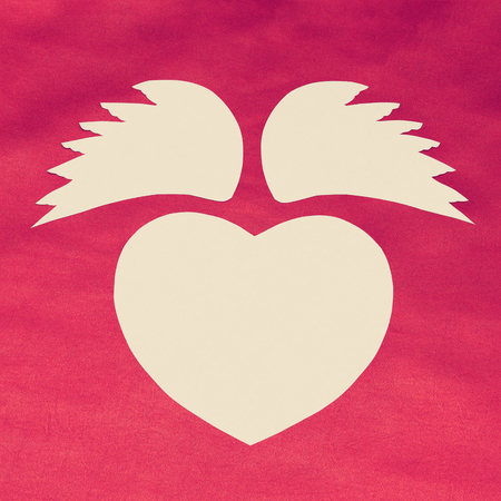 White heart with text, I love you, on a red cloth. Waves in the form of bows. Valentine's Day.の写真素材