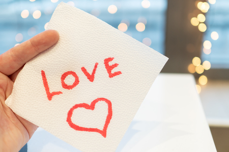 The cafe wrote a love message on a napkin. Valentine's Day.の写真素材