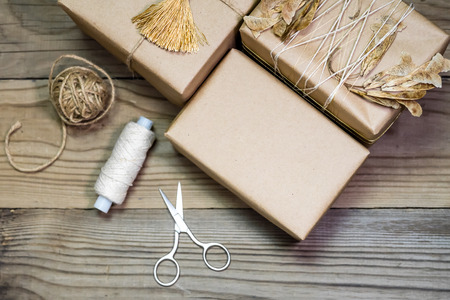 Gift box handmade from white paper, dry twigs, spruce. New Year Christmas.の写真素材