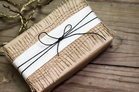 Gift box handmade from white paper, dry twigs, spruce. New Year Christmas.の写真素材