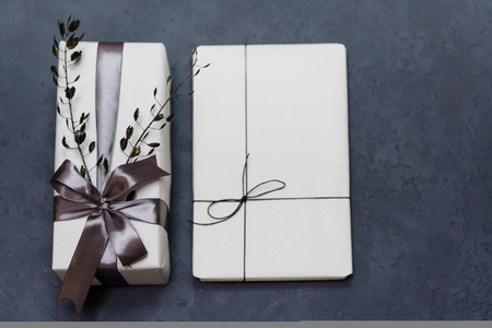Gift box handmade from white paper, dry twigs, spruce. New Year Christmas.の写真素材