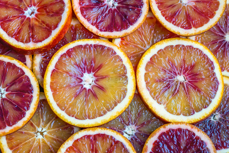 round slices of red orange, background and textureの写真素材
