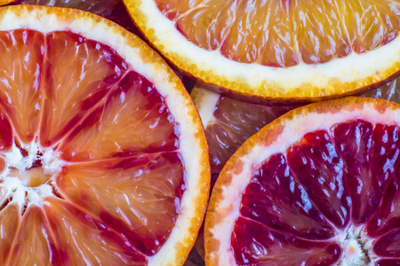 round slices of red orange, background and textureの写真素材