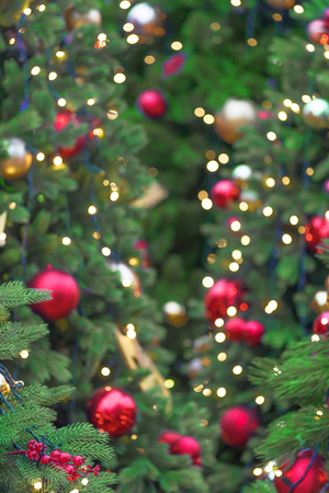 fir-tree decorated with Christmas balls and ribbons, traditional New Year holidayの写真素材