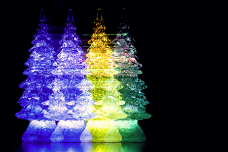 New Year's collage, colored glass Christmas trees, abstraction, neon effect, Christmas traditional holiday, polarizationの写真素材