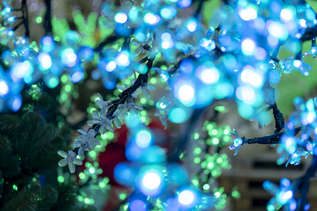 Christmas decorations, neon garlands, glowing flowers, the interior of the new yearの写真素材