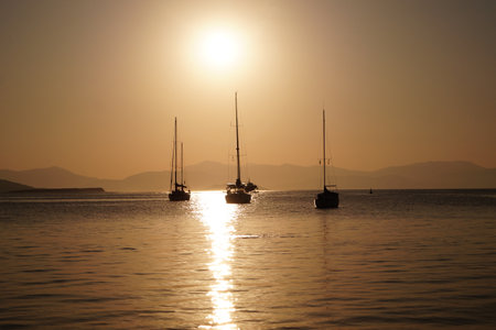 Boats in the sea during sunsetの写真素材