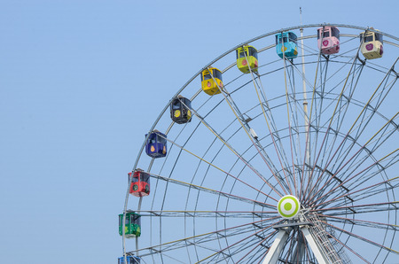 Holding a drink , Ferris wheel and leisure facilities In Taipei Children's Amusement Parkのeditorial素材