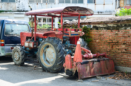 Construction vehicle parked on the roadside.