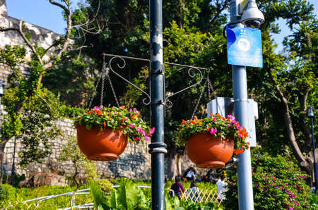 Macau-DEC 31, 2017: Flower pots hanging on the streetのeditorial素材
