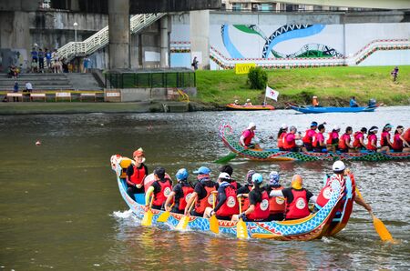 Taipei, Taiwan-JUN 08, 2019: Scene of a competitive boat racing in the traditional Dragon Boat Festival in Taiwan.の写真素材