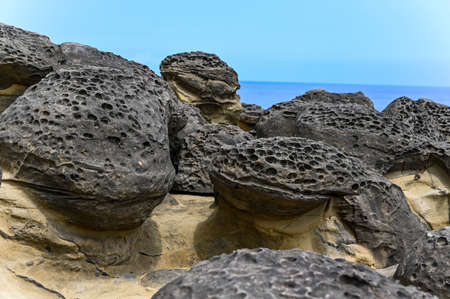Mushroom rock by the sea.の写真素材