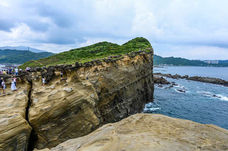 New Taipei, Taiwan-SEP 14, 2019: Many people come to visit trunk rock in Shenao Cape.のeditorial素材