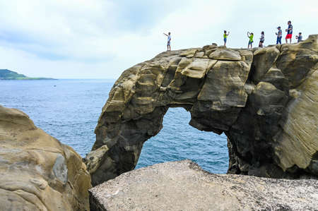 New Taipei, Taiwan-SEP 14, 2019: Many people come to visit elephant rock in shenao.のeditorial素材