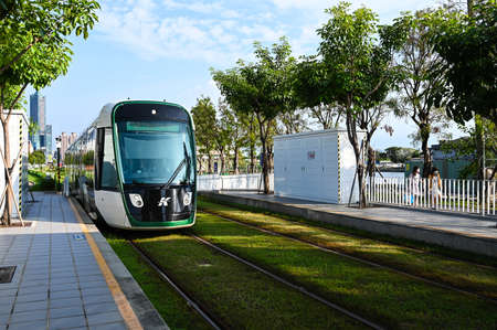 Kaohsiung, Taiwan - OCT 16, 2021: Kaohsiung's Light Rail Transit is driving on the road