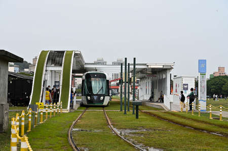 Kaohsiung, Taiwan - FEB 18, 2022: Kaohsiung's Light Rail Transit is driving on the road