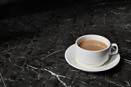 Hot coffee on marble table
