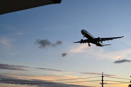 Taoyuan City, Taiwan - NOV 19, 2022: Airplane landing in the evening.のeditorial素材