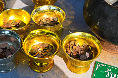 Samut Songkhram, Thailand - DEC 22, 2022: Thai money bowl in temple.