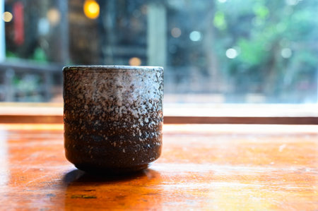 Japanese Tea cup on wooden table close-upの写真素材
