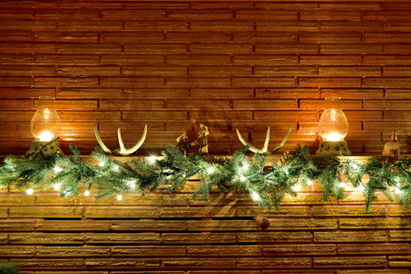 A fireplace mantlepiece decorated for Christmas.の写真素材