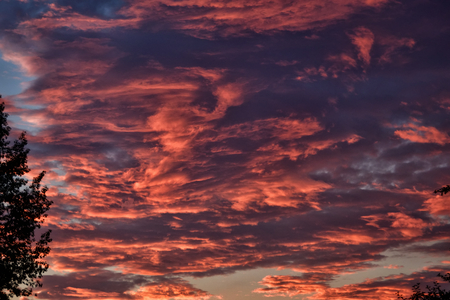 Coral orange sunset clouds for background.の写真素材