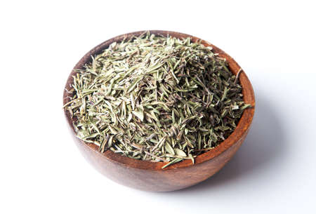 Dried organic thyme in bowl.On white backgroundの写真素材