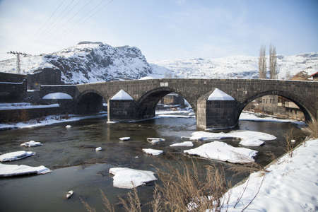 Kars, Turkey - 01/22/2016: This historical stone bridge built by the Ottoman Ruler Murat III. in...
