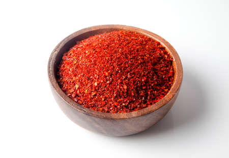 Red peppers in bowl.On white backgroundの写真素材