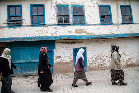 Nallihan,Ankara,Turkey - 05-12-2016:Old village house and women in Nallihan districtのeditorial素材
