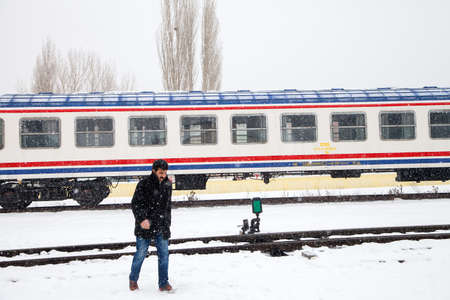 Kars/Turkey-01/24/2016: Unknown people walking in the train station on a cold winter day.のeditorial素材
