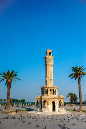 Ä°zmir historical clock tower and pigeonsの写真素材