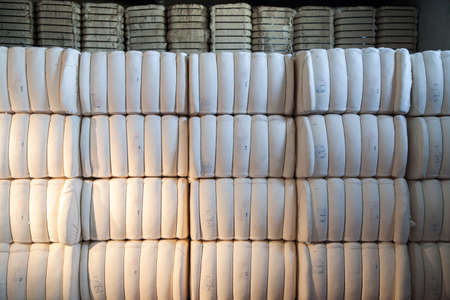 Raw cotton bales in textile factory.の写真素材