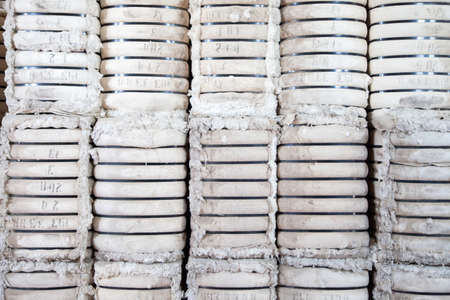 Raw cotton bales in textile factory.の写真素材