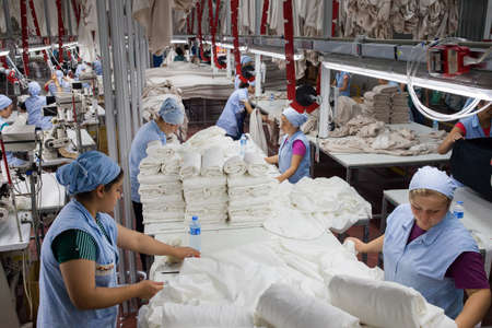 Denizli / Turkey - 06/07/2014: Unknown female workers working in a textile factory.のeditorial素材