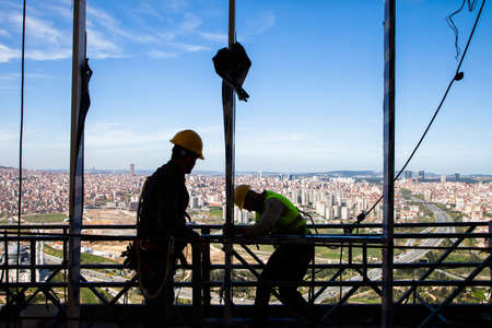 Istanbul,Turkey - 04-02-2013:Construction workers in Istanbul work safely in a multi-storey buildingのeditorial素材