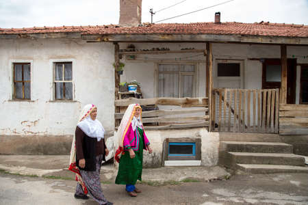 Nallihan,Ankara,Turkey - 05-12-2016:Old village house and women in Nallihan districtのeditorial素材