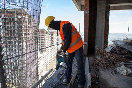 Istanbul,Turkey - 02-01-2013:Workers working on the high apartment building under construction