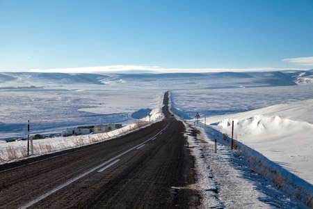 Landscape of a snowy asphalt road,Kars provinceの写真素材