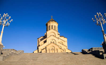 View of Holy Trinity Cathedral with blue sky at sunset, Tbilisi, Georgiaの写真素材