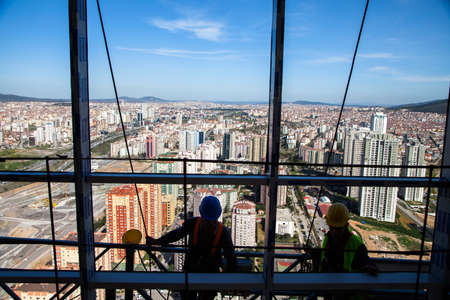 Istanbul,Turkey - 04-02-2013:Construction workers in Istanbul work safely in a multi-storey buildingのeditorial素材