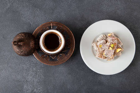 Traditional pistachio Turkish delight and Turkish coffee, top view