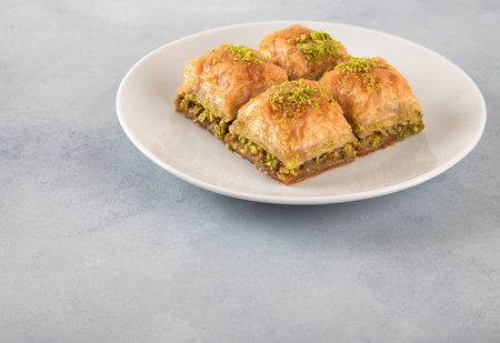 Pistachio baklava on a white plate.Traditional delicious Turkish baklavaの写真素材