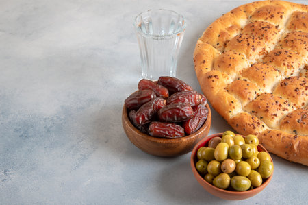Traditional iftar table with dates, pita, green olives