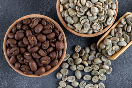 Coffee beans in wooden bowls on dark background. top viewの写真素材
