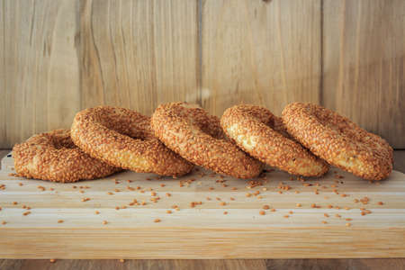Sesame bagesl. Bagels with wooden background. Turkish bagels. Traditional sesame turkish bagel. Ramadan background. High quality photoの写真素材