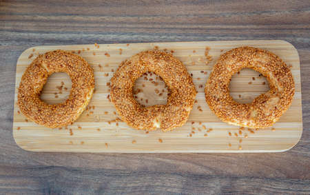 Sesame bagesl. Bagels with wooden background. Turkish bagels. Traditional sesame turkish bagel. Ramadan background. High quality photoの写真素材
