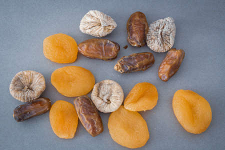 Ramadan background. Islamic culture and Ramadan. Dried apricots, dried figs and dates photo. High quality photoの写真素材